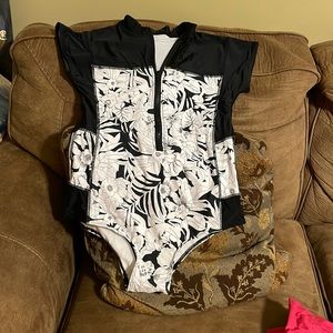 One piece swim suit. Brand new. Never worn.